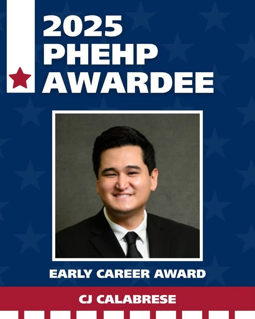 Professor CJ Calabrese with a banner for the 2025 PHEHP Award 