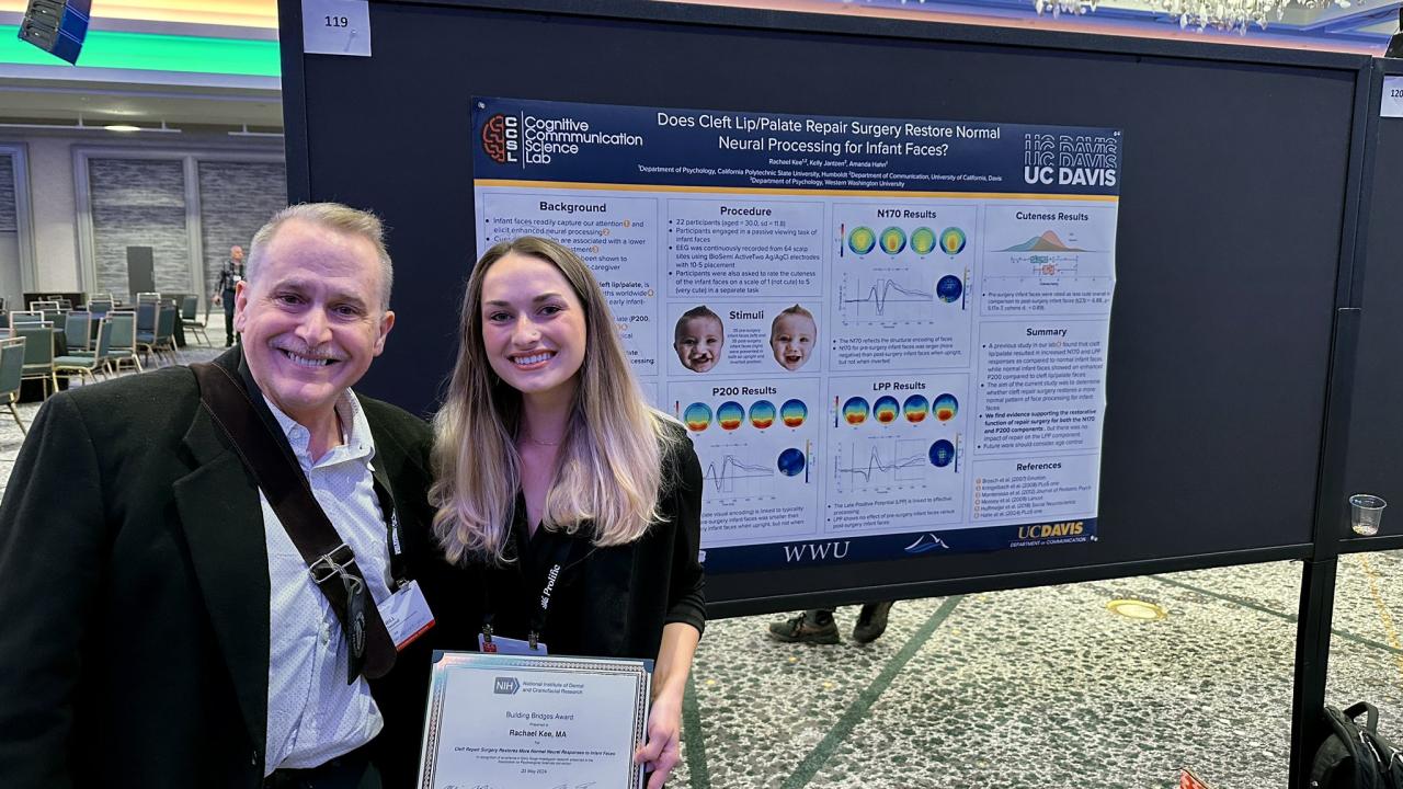 Rachael Kee is presented with her NIH Building Bridges award at APS24